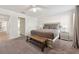 Main bedroom features plush carpeting, natural light, and neutral tones for a serene retreat at 5512 Solterra Cir, Davenport, FL 33837