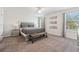 Spacious main bedroom with carpeted floors, windows, and ambient lighting for ultimate comfort at 5512 Solterra Cir, Davenport, FL 33837