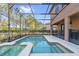 Screened-in pool and spa area offers a private outdoor oasis for relaxation and recreation at 5512 Solterra Cir, Davenport, FL 33837