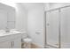 Clean bathroom with glass-enclosed shower, white vanity, and tile flooring at 570 Summit River Dr, Apopka, FL 32712