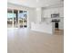 Open-concept kitchen with island and stainless steel appliances flowing into bright living space at 570 Summit River Dr, Apopka, FL 32712