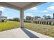 Covered patio overlooking the backyard, perfect for entertaining or relaxing outdoors at 570 Summit River Dr, Apopka, FL 32712