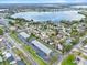 Aerial view shows lake and neighborhood at 623 Lake Dexter Cir, Winter Haven, FL 33884