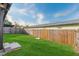 Back yard with a well maintained lawn and fenced perimeter at 623 Lake Dexter Cir, Winter Haven, FL 33884