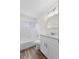 This bathroom features a shower-tub combo, white vanity, and modern fixtures at 623 Lake Dexter Cir, Winter Haven, FL 33884