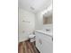 Modern bathroom features updated vanity and fixtures and wood-look floors at 623 Lake Dexter Cir, Winter Haven, FL 33884