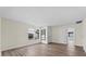 Well-lit bedroom with neutral walls, base trim, and wide plank flooring at 623 Lake Dexter Cir, Winter Haven, FL 33884