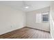 Bright bedroom with a ceiling fan, hardwood floors, and a window for natural light at 623 Lake Dexter Cir, Winter Haven, FL 33884