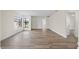 Neutral bedroom featuring modern flooring, walls, and a large sunlit window at 623 Lake Dexter Cir, Winter Haven, FL 33884