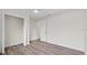 Bright bedroom featuring wood-look floors and neutral walls at 623 Lake Dexter Cir, Winter Haven, FL 33884