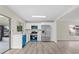 Open concept kitchen with stainless steel appliances and access to the patio at 623 Lake Dexter Cir, Winter Haven, FL 33884