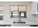 Close-up of the modern kitchen sink and countertops in a well lit space at 623 Lake Dexter Cir, Winter Haven, FL 33884