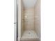 Updated shower features modern tile and flooring at 623 Lake Dexter Cir, Winter Haven, FL 33884