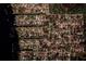 Aerial view of residential neighborhood near a lake, highlighting the density of homes and surrounding trees at 6449 Eve St, St Cloud, FL 34771