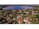 Aerial view of a neighborhood, showcasing the home's location near a lake at 6449 Eve St, St Cloud, FL 34771