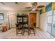 Dining area featuring a table and chairs, a ceiling fan, and access to the screened-in porch at 6449 Eve St, St Cloud, FL 34771