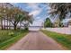 Lakefront property featuring a private boat ramp access through a concrete driveway at 6449 Eve St, St Cloud, FL 34771