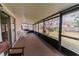 Screened porch with outdoor seating area, offering a relaxing view of the backyard at 6449 Eve St, St Cloud, FL 34771