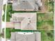 Birds eye view of a beautiful well maintained home showing the brick paved driveway and manicured lawn at 6974 Trellis Vine Loop, Windermere, FL 34786
