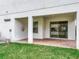 A view of the covered back patio and backyard beyond at 6974 Trellis Vine Loop, Windermere, FL 34786