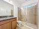 Bathroom features granite counters, wood cabinets, and a glass enclosed tiled shower at 6974 Trellis Vine Loop, Windermere, FL 34786
