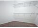Carpeted walk-in closet with wire shelving at 6974 Trellis Vine Loop, Windermere, FL 34786