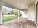Covered outdoor patio with brick pavers and a view of the backyard at 6974 Trellis Vine Loop, Windermere, FL 34786