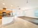Open concept kitchen with tile floor and island flowing into living area at 6974 Trellis Vine Loop, Windermere, FL 34786