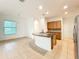 Bright kitchen features an island, tile floors, stainless steel appliances, and lots of cabinet space at 6974 Trellis Vine Loop, Windermere, FL 34786