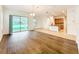 Open concept floorplan featuring a large glass slider, modern floors, and a kitchen island with bar seating at 6974 Trellis Vine Loop, Windermere, FL 34786