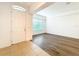 Bright living room with modern floors, large windows, and open entryway at 6974 Trellis Vine Loop, Windermere, FL 34786