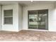 The covered patio features brick pavers and a sliding glass door at 6974 Trellis Vine Loop, Windermere, FL 34786