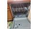 This kitchen has an open Frigidaire dishwasher ready for loading at 8137 Claire Ann Dr # 203, Orlando, FL 32825