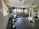 Well-equipped fitness center with treadmills, elliptical machines, and weight training equipment at 8137 Claire Ann Dr # 203, Orlando, FL 32825