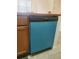 This kitchen features a Frigidaire dishwasher with a blue protective sheet at 8137 Claire Ann Dr # 203, Orlando, FL 32825