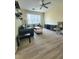 Open living room with sleek furniture, neutral walls, and modern ceiling fan at 8137 Claire Ann Dr # 203, Orlando, FL 32825