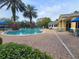 Community pool area featuring a sun deck, lounge chairs and a clean body of water at 8137 Claire Ann Dr # 203, Orlando, FL 32825