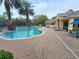 Community pool area featuring a sun deck, lounge chairs and a clean body of water at 8137 Claire Ann Dr # 203, Orlando, FL 32825