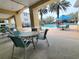 Relaxing pool area with tables and chairs, perfect for enjoying the outdoors and socializing at 8137 Claire Ann Dr # 203, Orlando, FL 32825