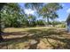 A large backyard with chain link fence, mature trees, and plenty of space at 1006 San Domingo Rd, Orlando, FL 32808