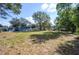 Large backyard with mature trees and plenty of space for outdoor activities at 1006 San Domingo Rd, Orlando, FL 32808