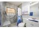 Nicely updated bathroom featuring a shower with a built-in seat at 1006 San Domingo Rd, Orlando, FL 32808
