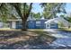 Charming single-story home with a covered parking area and well-maintained front yard at 1006 San Domingo Rd, Orlando, FL 32808