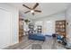 A cozy living room with new floors, ceiling fan, and plenty of natural light at 1006 San Domingo Rd, Orlando, FL 32808