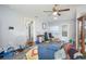 Open living room showcasing updated flooring, soothing color palette, and a ceiling fan at 1006 San Domingo Rd, Orlando, FL 32808