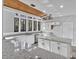 Modern kitchen with granite countertops, stainless steel appliances, and large windows for natural light at 104 Wild Plum Ln, Longwood, FL 32779