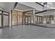 A spacious outdoor patio features multiple doors and windows, perfect for enjoying the scenery at 104 Wild Plum Ln, Longwood, FL 32779