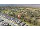 Aerial view showcases the home near a picturesque landscape of green fields and trees at 1097 Hendon Loop, Davenport, FL 33837
