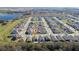 Aerial view showcases the home's location within a well-planned community with tree-lined streets at 1097 Hendon Loop, Davenport, FL 33837