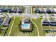 Aerial view of community pool and surrounding houses in neighborhood at 1097 Hendon Loop, Davenport, FL 33837